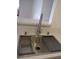 Stylish modern sink in kitchen with stainless steel features and white countertop at 5241 Caspian Springs Dr # 103, Las Vegas, NV 89120