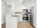 Beautiful kitchen with stainless steel appliances and white cabinetry at 5241 Caspian Springs Dr # 103, Las Vegas, NV 89120
