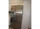 Spacious kitchen featuring a stainless steel refrigerator and white cabinetry at 5241 Caspian Springs Dr # 103, Las Vegas, NV 89120