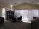 Well-lit meeting room with large windows, comfortable seating, and a bookshelf at 5241 Caspian Springs Dr # 103, Las Vegas, NV 89120