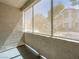 A screen-enclosed patio offers shade from trees and adjacent buildings at 5241 Caspian Springs Dr # 103, Las Vegas, NV 89120
