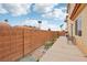 Large backyard with brick wall, patio and BBQ at 5286 Monterey Park Cir, Las Vegas, NV 89146