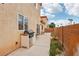 Cozy backyard patio with built-in barbecue, perfect for outdoor dining and entertaining with privacy walls and natural light at 5286 Monterey Park Cir, Las Vegas, NV 89146
