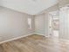 Bedroom with modern chandelier and wood-style flooring at 5286 Monterey Park Cir, Las Vegas, NV 89146