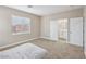 Bedroom featuring carpet, neutral paint and doors to the en-suite bathroom at 5286 Monterey Park Cir, Las Vegas, NV 89146