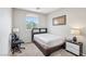 A comfortable bedroom with a large window, allowing for natural light and ventilation at 5286 Monterey Park Cir, Las Vegas, NV 89146