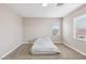 Bright bedroom with carpet, two windows and neutral paint, awaiting personalization at 5286 Monterey Park Cir, Las Vegas, NV 89146