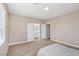 Bedroom featuring carpet, neutral paint and doors to the en-suite bathroom at 5286 Monterey Park Cir, Las Vegas, NV 89146