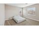 Bright bedroom with carpet, two windows and neutral paint, awaiting personalization at 5286 Monterey Park Cir, Las Vegas, NV 89146