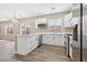 Well-lit kitchen with stainless steel appliances and a breakfast bar at 5286 Monterey Park Cir, Las Vegas, NV 89146