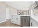 Spacious kitchen with stainless dishwasher, breakfast bar, and sleek cabinets at 5286 Monterey Park Cir, Las Vegas, NV 89146