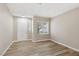 A bright and airy living room with new laminate floors and a large window for plenty of natural light at 5286 Monterey Park Cir, Las Vegas, NV 89146
