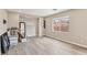 Open and airy living space featuring vinyl plank flooring and a large window at 5286 Monterey Park Cir, Las Vegas, NV 89146
