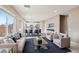 Open concept living room with modern decor and natural light at 5286 Monterey Park Cir, Las Vegas, NV 89146