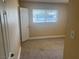 A bedroom with carpet flooring, neutral walls and a window for natural light at 5424 Del Rey Ave, Las Vegas, NV 89146