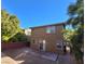 A full view of the home's backyard featuring a privacy fence and patio at 5445 Indian Cedar Dr, Las Vegas, NV 89135