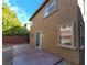 View of the home's backyard, featuring a concrete patio and a privacy fence at 5445 Indian Cedar Dr, Las Vegas, NV 89135