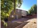 View of the home's backyard showing a patio and partial tree coverage at 5445 Indian Cedar Dr, Las Vegas, NV 89135