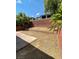 Unfinished backyard area with retaining wall, ready for landscaping and personalization at 5445 Indian Cedar Dr, Las Vegas, NV 89135
