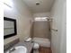 Bathroom with a granite vanity, neutral tile flooring, and a tub-shower combo at 5445 Indian Cedar Dr, Las Vegas, NV 89135