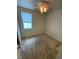 Bright bedroom featuring neutral carpeting and a ceiling fan with lighting at 5445 Indian Cedar Dr, Las Vegas, NV 89135