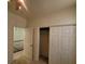 Bedroom with closet and view to hallway at 5445 Indian Cedar Dr, Las Vegas, NV 89135