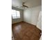 This bedroom features tile flooring and a ceiling fan with lighting at 5445 Indian Cedar Dr, Las Vegas, NV 89135