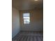 Bedroom featuring neutral carpeting, a window, and ample space at 5445 Indian Cedar Dr, Las Vegas, NV 89135
