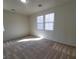 Bedroom features natural light from large windows and soft carpeting at 5445 Indian Cedar Dr, Las Vegas, NV 89135