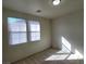 Well-lit bedroom with two windows, neutral walls and plush carpeting, offering a serene space at 5445 Indian Cedar Dr, Las Vegas, NV 89135
