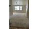 Upstairs bonus room features neutral carpet and three large windows for natural light at 5445 Indian Cedar Dr, Las Vegas, NV 89135