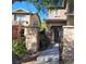 Stone pillars with wrought iron gate lead to the front door at 5445 Indian Cedar Dr, Las Vegas, NV 89135