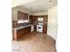 Open kitchen features tile backsplash, white appliances, and dark brown cabinetry at 5445 Indian Cedar Dr, Las Vegas, NV 89135