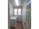 Laundry room featuring appliances, and dual windows for natural light at 5445 Indian Cedar Dr, Las Vegas, NV 89135