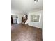 Open-concept living area with tile floors and staircase at 5445 Indian Cedar Dr, Las Vegas, NV 89135
