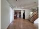 Open floorplan showcases a spacious living room area with tiled floors and easy access to the kitchen at 5445 Indian Cedar Dr, Las Vegas, NV 89135