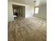 Spacious living room features neutral carpeting and lots of natural light at 5445 Indian Cedar Dr, Las Vegas, NV 89135