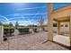 Backyard offers a low-maintenance space with fencing and views of the community landscape at 5524 Overlook Valley St, North Las Vegas, NV 89081