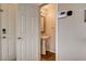 Small bathroom with pedestal sink, framed mirror and modern finishes at 5524 Overlook Valley St, North Las Vegas, NV 89081