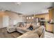 Open-concept living area featuring recessed lighting, wood floors and an island with seating at 5524 Overlook Valley St, North Las Vegas, NV 89081
