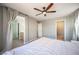 Bedroom featuring a ceiling fan, natural light, and views of the Primary bathroom and closet at 5638 Jelsma Ave, Las Vegas, NV 89141