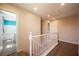 Upstairs hallway featuring wood-look flooring, neutral walls, and recessed lighting at 5638 Jelsma Ave, Las Vegas, NV 89141