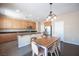 Bright eat-in kitchen features wood cabinets, stainless steel appliances, and granite countertops at 5638 Jelsma Ave, Las Vegas, NV 89141