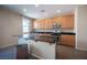 Kitchen features wood cabinets, stainless steel appliances, and granite countertops at 5638 Jelsma Ave, Las Vegas, NV 89141