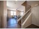Spacious living room featuring lots of natural light and direct access to the staircase at 5638 Jelsma Ave, Las Vegas, NV 89141