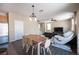 Open-concept living area with laminate flooring and neutral paint throughout at 5638 Jelsma Ave, Las Vegas, NV 89141