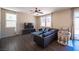 Comfortable living room with wood floors, lots of natural light, ceiling fan and modern furnishings at 5638 Jelsma Ave, Las Vegas, NV 89141