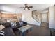 Open-concept living area showcasing wood floors, natural light, modern furnishings, and staircase at 5638 Jelsma Ave, Las Vegas, NV 89141