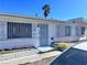 Charming single-story home showcasing window bars, security door, and a manicured front yard at 6112 Denver Cir, Las Vegas, NV 89107