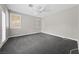 Spacious bedroom with neutral carpet, shuttered windows, and ceiling fan at 616 Canyon Brook Pl, Las Vegas, NV 89145